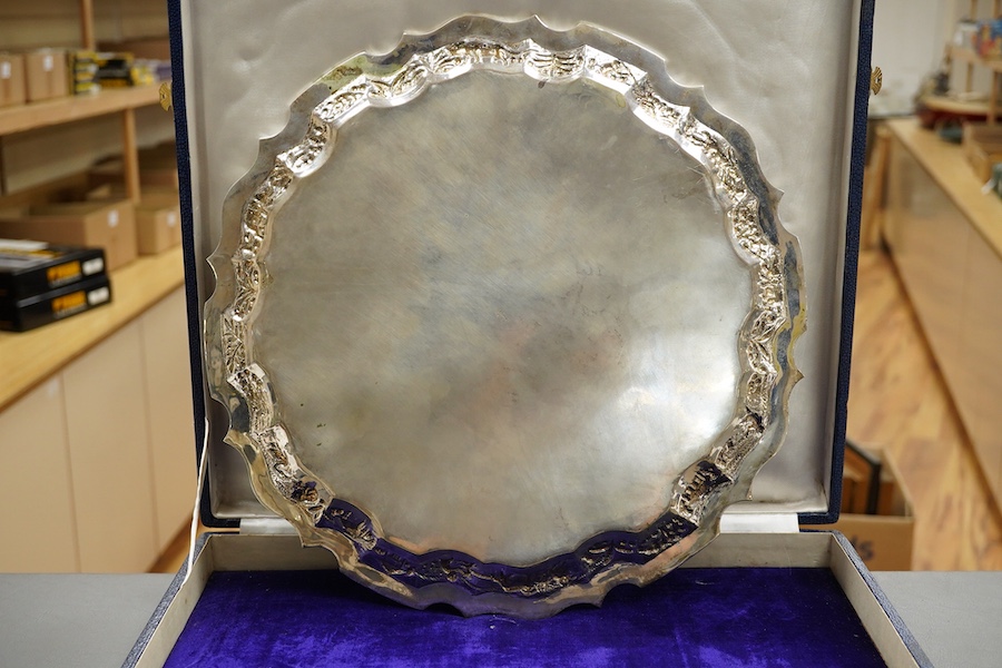 A mid 20th century Indian white metal (stamped sterling silver) presentation salver, engraved with numerous signatures, diameter 35.6cm, 36.8oz, with box.